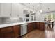 Kitchen featuring stainless steel appliances, custom cabinetry, and plenty of counter space at 3668 Spring St, Chamblee, GA 30341
