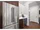 Stainless steel refrigerator and beverage center nestled in the kitchen's stylish design at 3668 Spring St, Chamblee, GA 30341