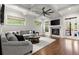 Bright living room boasts coffered ceilings, fireplace, and expansive windows providing natural light at 3668 Spring St, Chamblee, GA 30341