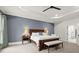 The main bedroom boasts hardwood furniture, a tray ceiling, and an ensuite bathroom with a glass enclosed shower at 3668 Spring St, Chamblee, GA 30341