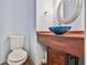 Stylish half bath with a unique sink, wood vanity, and modern fixtures at 3688 E Bay St, Duluth, GA 30096