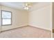 Cozy bedroom with neutral carpet, natural lighting, and simple design at 3688 E Bay St, Duluth, GA 30096