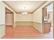 This dining room features wood floors and trim, and a view into the kitchen at 3688 E Bay St, Duluth, GA 30096