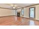 Bright living room with hardwood floors, fireplace, ceiling fan, and natural light at 3688 E Bay St, Duluth, GA 30096