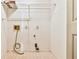 Basement utility area with storage shelves and access for washing machine hookups at 3688 E Bay St, Duluth, GA 30096