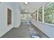 Inviting sunroom with ceiling fans, neutral carpet, and ample natural light at 3688 E Bay St, Duluth, GA 30096