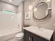 Modern bathroom with a tub, white tile, and custom vanity at 3801 Bays Ferry Trl, Marietta, GA 30062