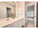 Bathroom with double sinks and a view of a bedroom from the open doorway at 3801 Bays Ferry Trl, Marietta, GA 30062