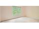 Bedroom with a window overlooking greenery and neutral carpet at 3801 Bays Ferry Trl, Marietta, GA 30062