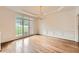 Bright dining room featuring hardwood floors, wainscoting, and a large window at 3801 Bays Ferry Trl, Marietta, GA 30062