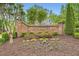 The neighborhood entrance featuring brick signage with manicured landscaping at 3801 Bays Ferry Trl, Marietta, GA 30062