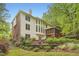 Back exterior of home featuring multi-level deck and mature trees at 3801 Bays Ferry Trl, Marietta, GA 30062