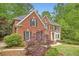 Well-maintained brick home with a manicured lawn and mature landscaping at 3801 Bays Ferry Trl, Marietta, GA 30062
