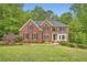 Charming two-story brick home with well-kept landscaping and inviting curb appeal at 3801 Bays Ferry Trl, Marietta, GA 30062