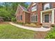 Brick home on a large lot with mature trees and landscaping at 3801 Bays Ferry Trl, Marietta, GA 30062