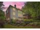 Exterior of home featuring multi-level deck and mature trees at 3801 Bays Ferry Trl, Marietta, GA 30062