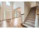 Bright foyer with hardwood floors, staircase, and views into the formal living room at 3801 Bays Ferry Trl, Marietta, GA 30062
