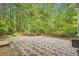 Outdoor stone patio with lush landscaping at 3801 Bays Ferry Trl, Marietta, GA 30062