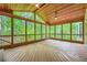 Spacious screened porch with wood floors and wooded views at 3801 Bays Ferry Trl, Marietta, GA 30062