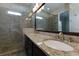 Bathroom with tiled shower, granite countertops, and double sinks at 569 Mirrormont Se Dr, Smyrna, GA 30080