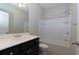 Clean bathroom featuring a tub with shower, vanity, and modern fixtures at 569 Mirrormont Se Dr, Smyrna, GA 30080