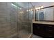 Bathroom with tiled shower and sleek dark vanity at 569 Mirrormont Se Dr, Smyrna, GA 30080