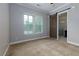 Bedroom with carpet, and doorway to bathroom with glass enclosed shower at 569 Mirrormont Se Dr, Smyrna, GA 30080