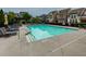 Beautiful community pool area with lounge chairs and well-maintained landscaping at 569 Mirrormont Se Dr, Smyrna, GA 30080
