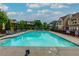 Inviting community pool surrounded by lush greenery and comfortable lounge chairs at 569 Mirrormont Se Dr, Smyrna, GA 30080
