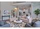 Living room with modern furniture, a patterned rug, and an open floor plan at 569 Mirrormont Se Dr, Smyrna, GA 30080