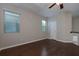 Light-filled loft featuring hardwood floors, large windows, and neutral walls at 569 Mirrormont Se Dr, Smyrna, GA 30080