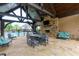 Inviting poolside lounge area with a stone fireplace and ample seating at 569 Mirrormont Se Dr, Smyrna, GA 30080