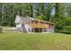Charming brick home featuring a large deck, covered porch, and fenced yard at 3471 Elgin Dr, Decatur, GA 30032