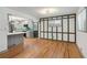 Open concept kitchen and dining area with hardwood floors and updated finishes at 3471 Elgin Dr, Decatur, GA 30032