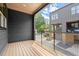 Wide angle of the wood-floored balcony that offers a view of the neighborhood at 1122 W Marietta St, Atlanta, GA 30318