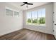 Bright bedroom featuring hardwood floors, a modern ceiling fan and plenty of natural light from the large windows at 1122 W Marietta St, Atlanta, GA 30318