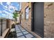 Entryway displaying the stone walkway, dark front door, and the brick facade of the townhome at 1122 W Marietta St, Atlanta, GA 30318