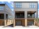 Stylish modern townhomes featuring balconies, metal siding, and garage parking for urban living at 1122 W Marietta St, Atlanta, GA 30318