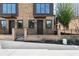 Close-up of a modern townhome showcasing the brickwork, black metal accents, and landscaping details at 1122 W Marietta St, Atlanta, GA 30318