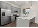 Modern kitchen showcases stainless steel appliances, gray cabinetry, and quartz countertops at 1122 W Marietta St, Atlanta, GA 30318