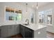 Charming kitchen featuring gray cabinetry, stainless sink, and views of the community at 1122 W Marietta St, Atlanta, GA 30318