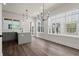 Open kitchen boasts gray cabinets, white countertop island, and stylish pendant lighting at 1122 W Marietta St, Atlanta, GA 30318