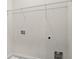 Laundry room showing connections for washer and dryer and a wire shelf at 1122 W Marietta St, Atlanta, GA 30318