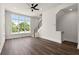 Bright living room boasts large windows, hardwood floors, and a modern ceiling fan at 1122 W Marietta St, Atlanta, GA 30318