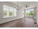 Spacious living room with hardwood flooring and large windows for abundant light at 1122 W Marietta St, Atlanta, GA 30318