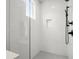 Bright shower with white tile and dark hardware at 1122 W Marietta St, Atlanta, GA 30318