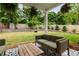 Spacious backyard featuring green lawn, patio area, and lush landscaping at 1378 Lochland Se Rd, Atlanta, GA 30316
