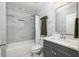 Elegant bathroom features a shower/tub combo with gray marble tiling and modern fixtures at 1378 Lochland Se Rd, Atlanta, GA 30316