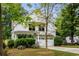 Charming two-story home featuring a white exterior, attached garage, and well-manicured landscaping at 1378 Lochland Se Rd, Atlanta, GA 30316