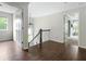 Spacious hallway with hardwood floors provides access to multiple rooms with natural light at 1378 Lochland Se Rd, Atlanta, GA 30316